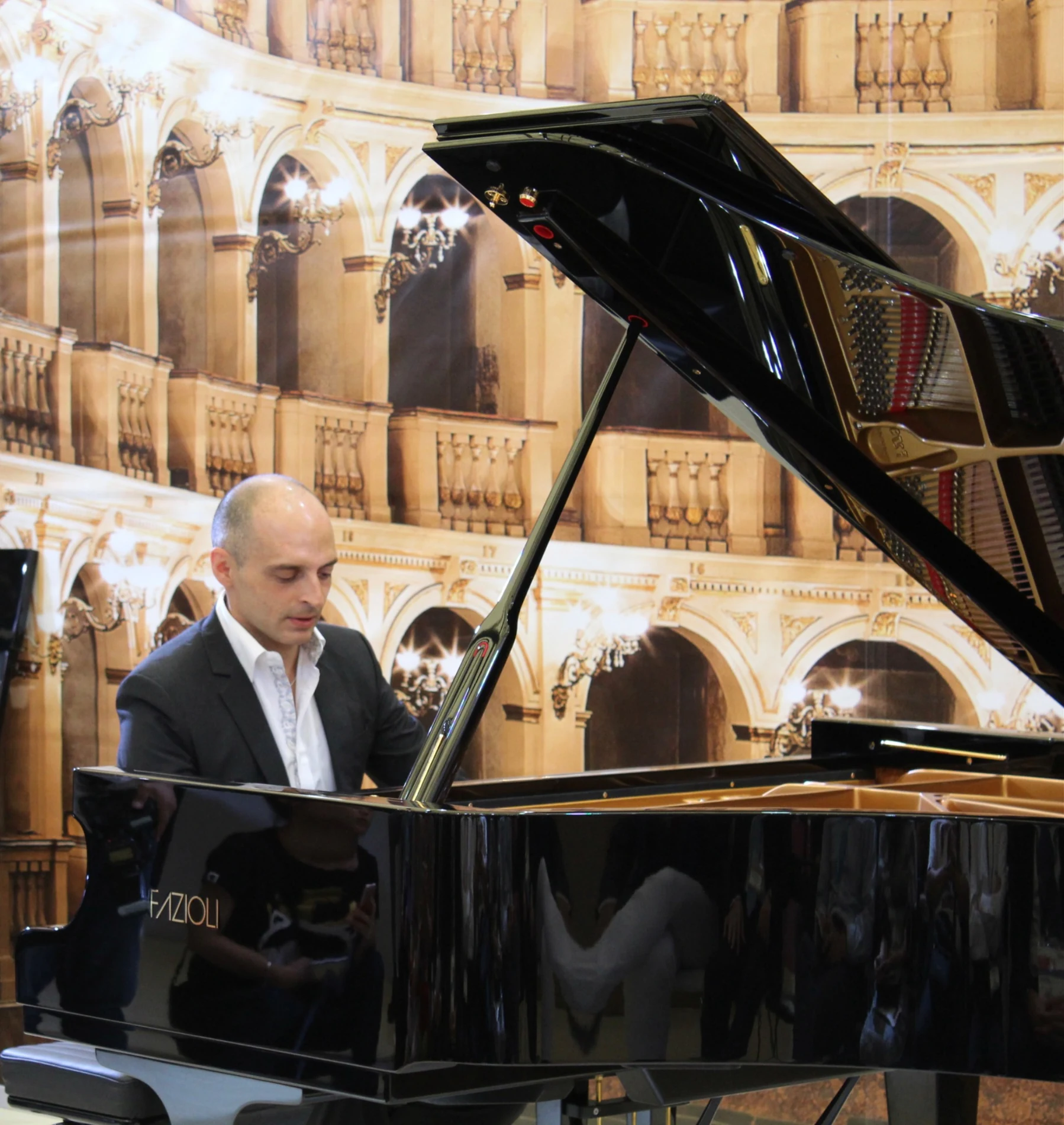 Ivan Yanakov performing at a Fazioli grand piano