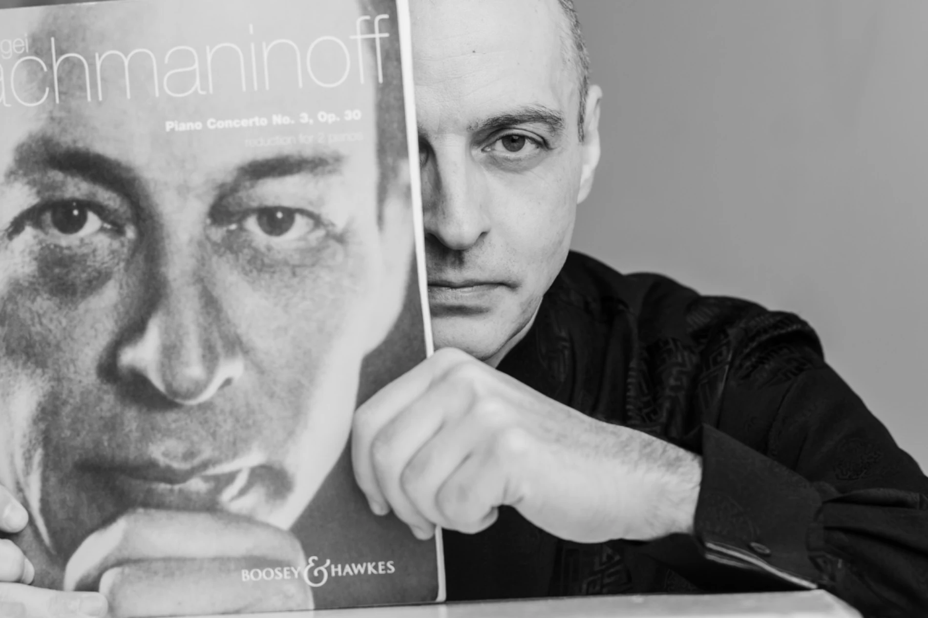 Ivan Yanakov holding a score of Rachmaninoff’s Third Piano Concerto